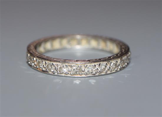 A white metal and diamond set full eternity ring, size K/L.